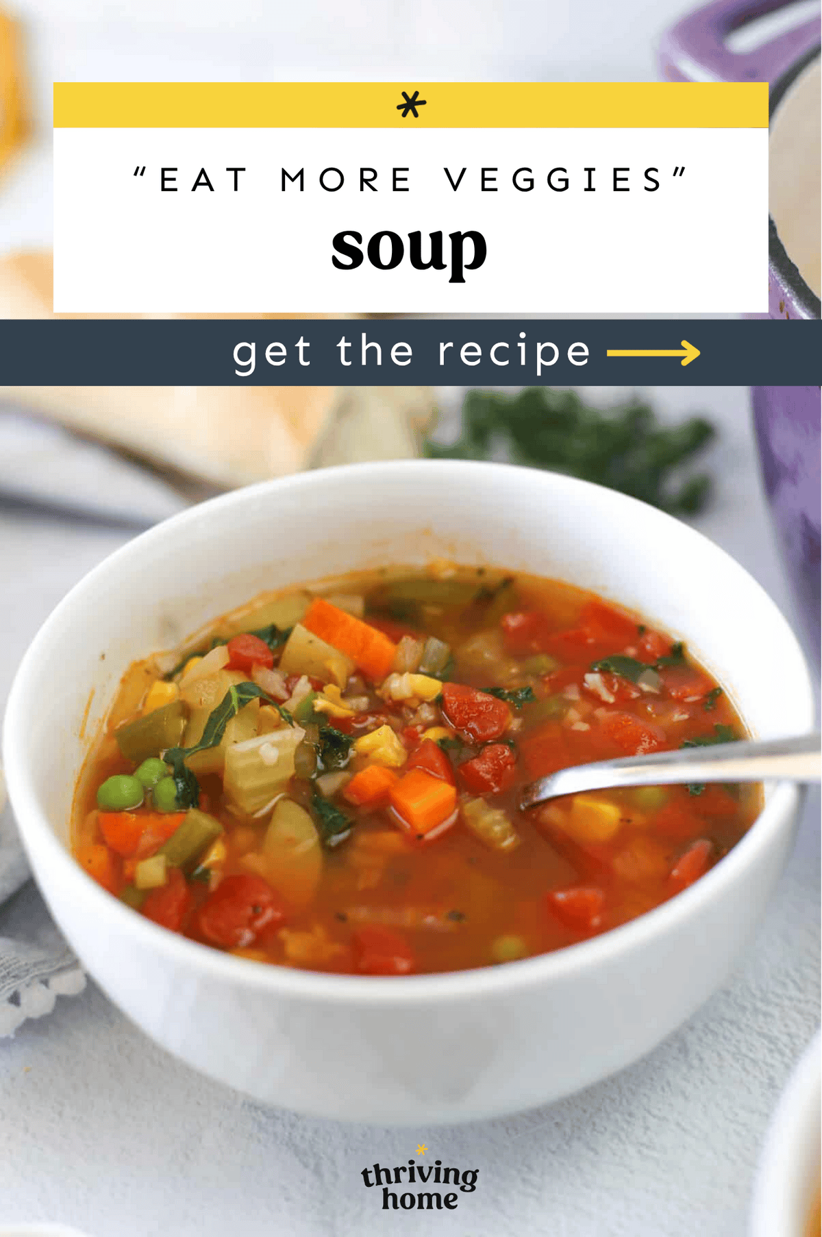 Bowl of veggie soup with a spoon ready to eat.