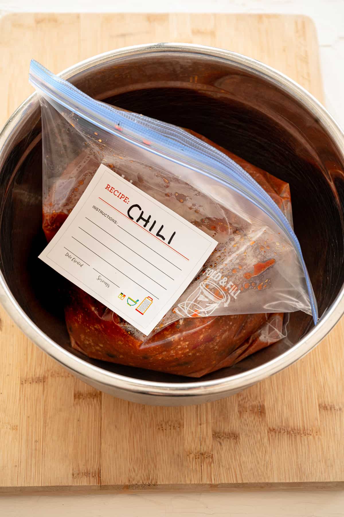 Chili bagged up and placed in an instant pot insert to prepare for freezing.