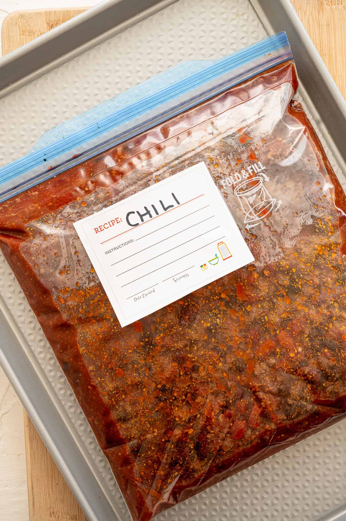 Chili prepped as a freezer meal in a ziplock bag with a label.