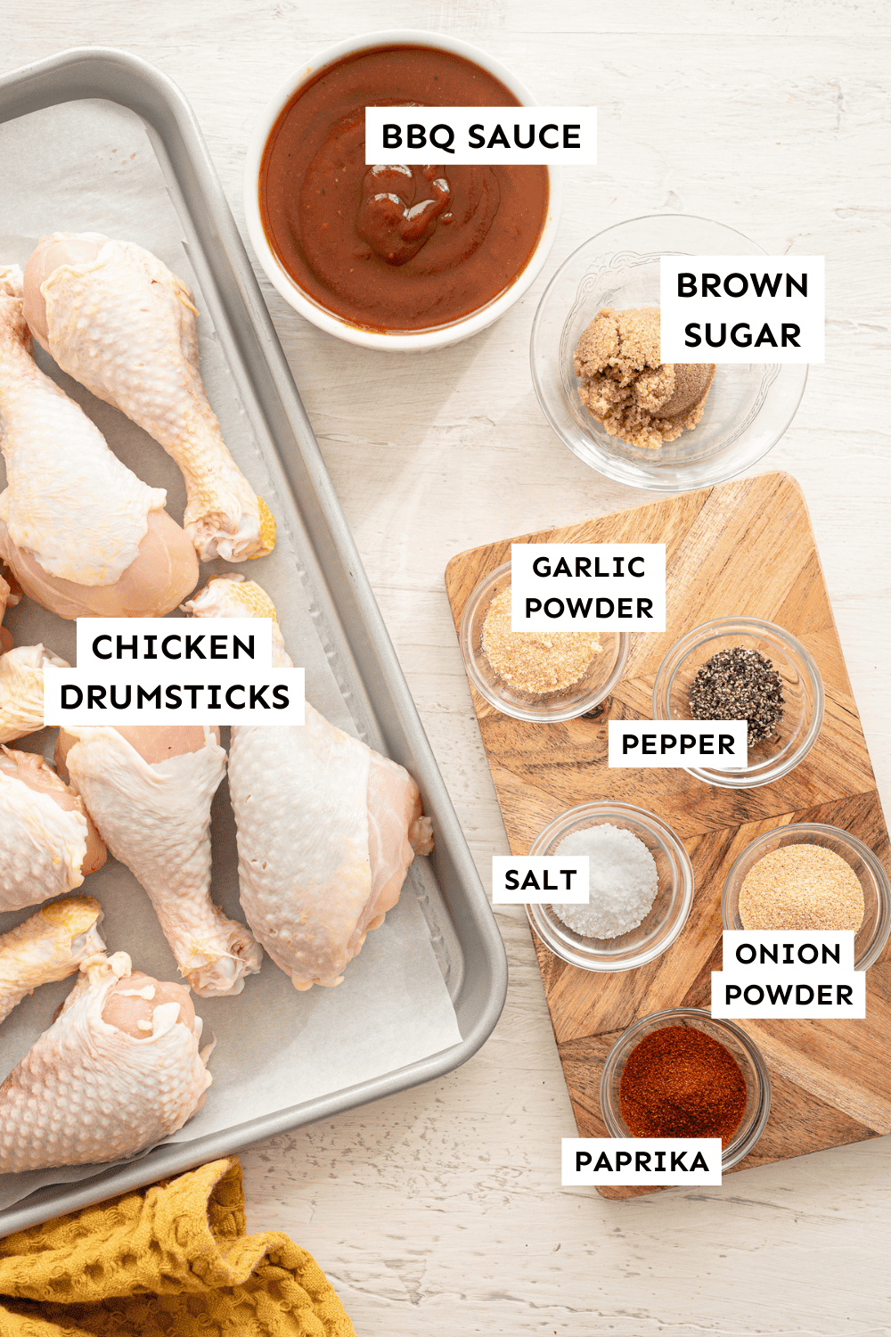Ingredients for BBQ chicken drumsticks measured out and labeled.