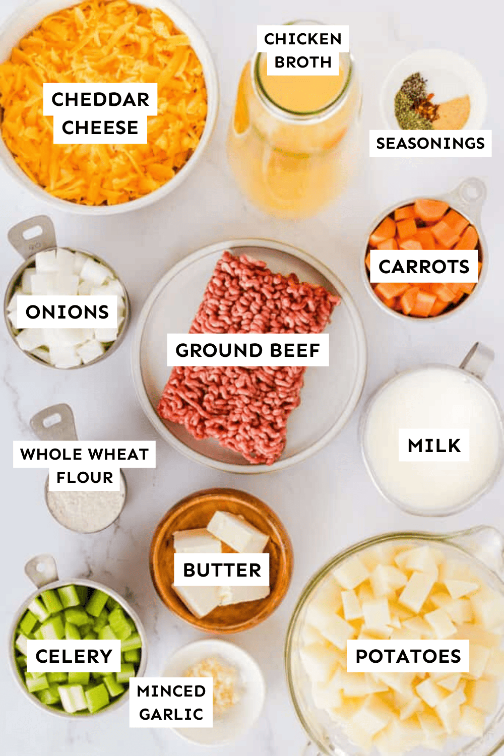 Cheeseburger soup ingredients measured out in bowls and labeled.