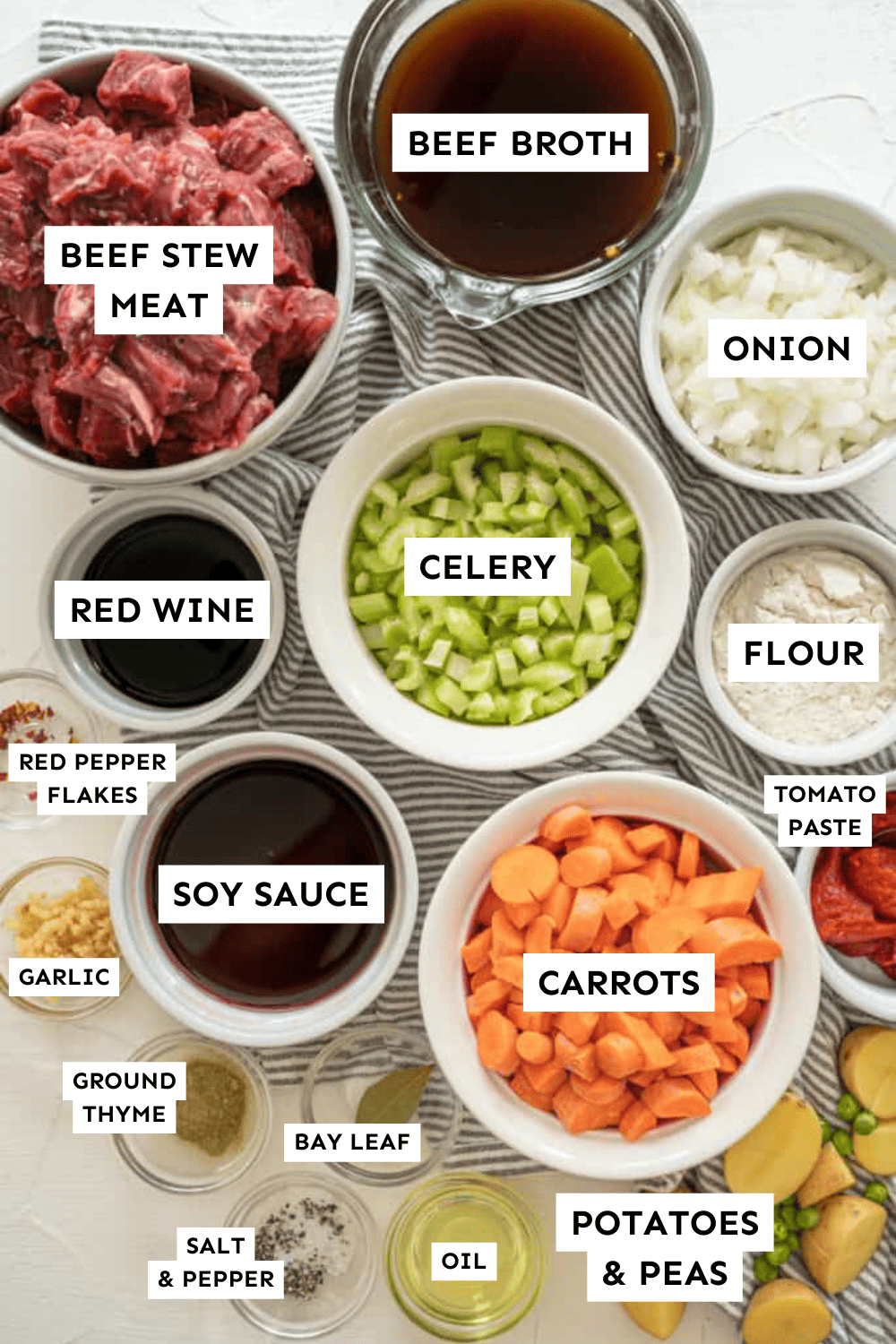 Instant Pot beef stew ingredients measured out in bowls and labeled.