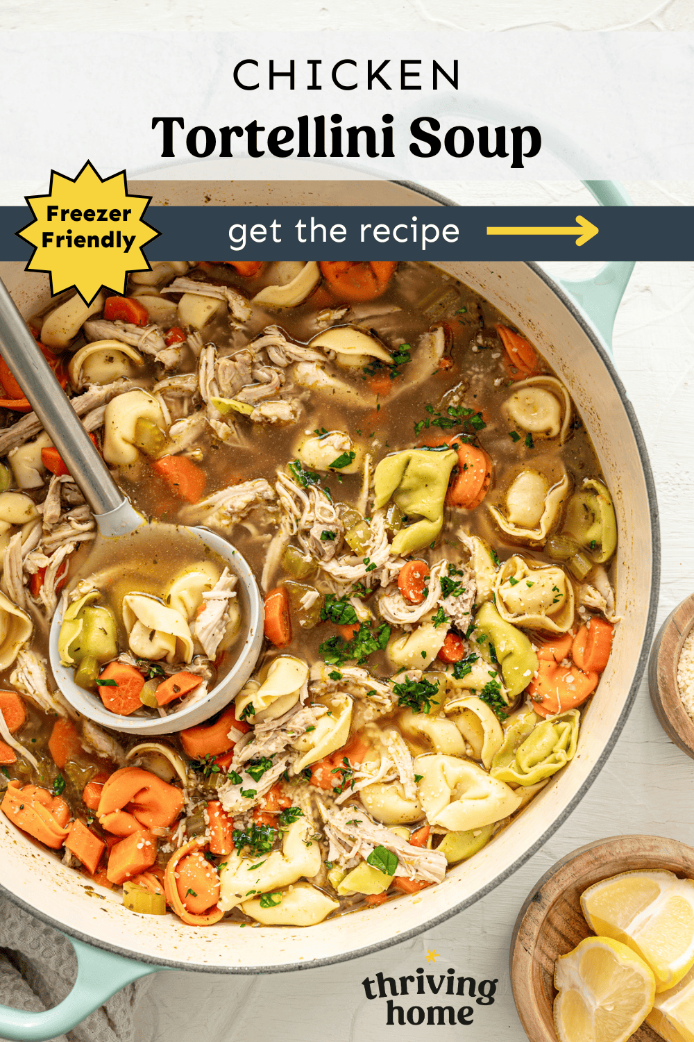 Chicken tortellini soup in a pot with a ladle ready to serve.