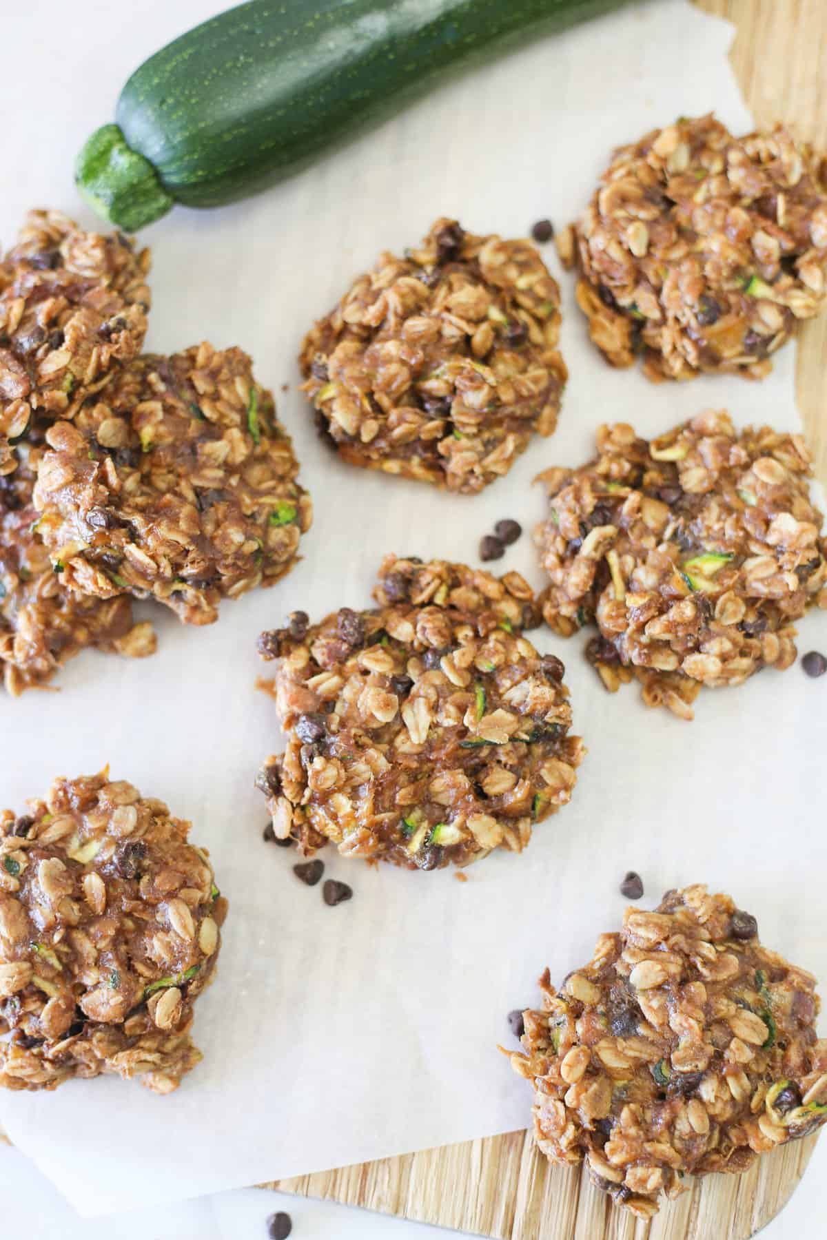 Zucchini Breakfast Cookies cooling on parchment paper.