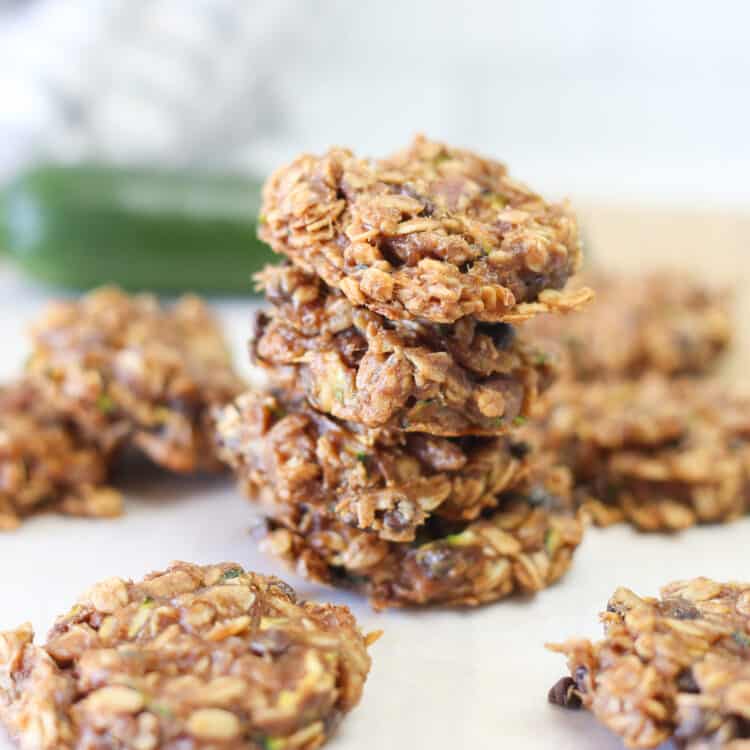 Stack of zucchini breakfast cookies with other cookies all around it.