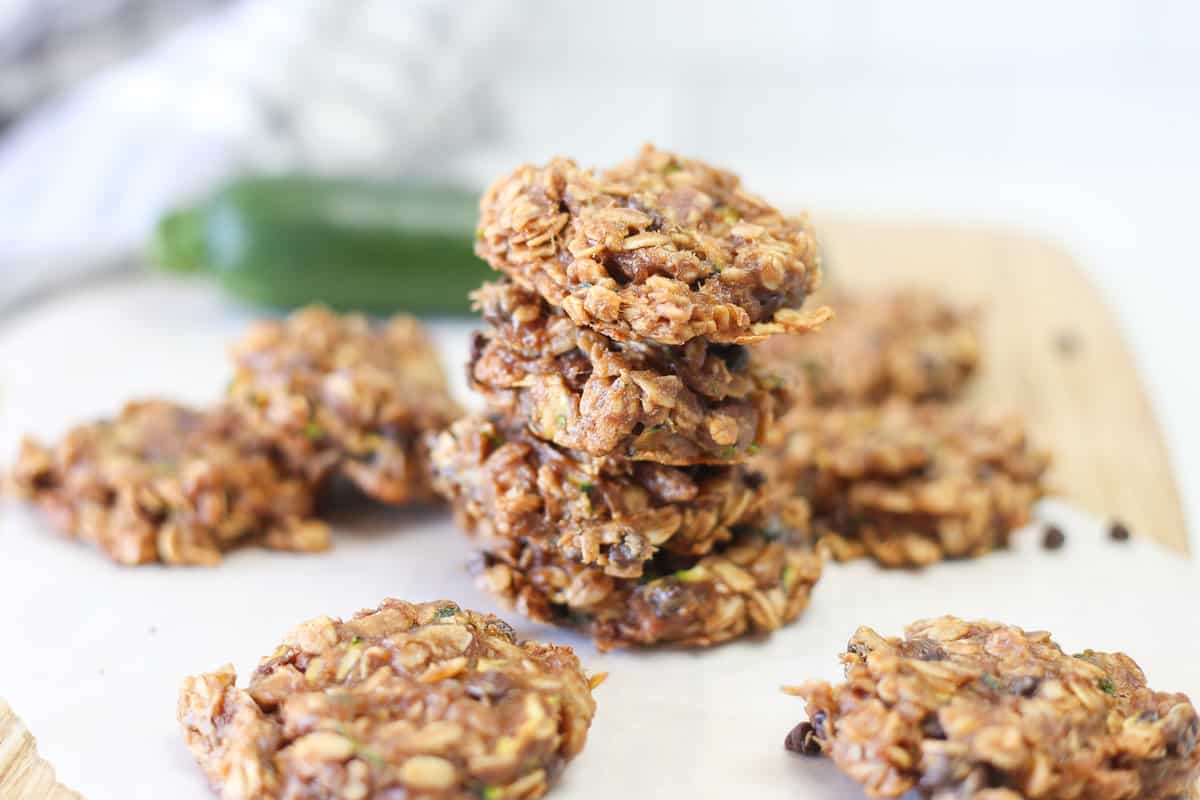 Stack of zucchini breakfast cookies with other cookies all around it.