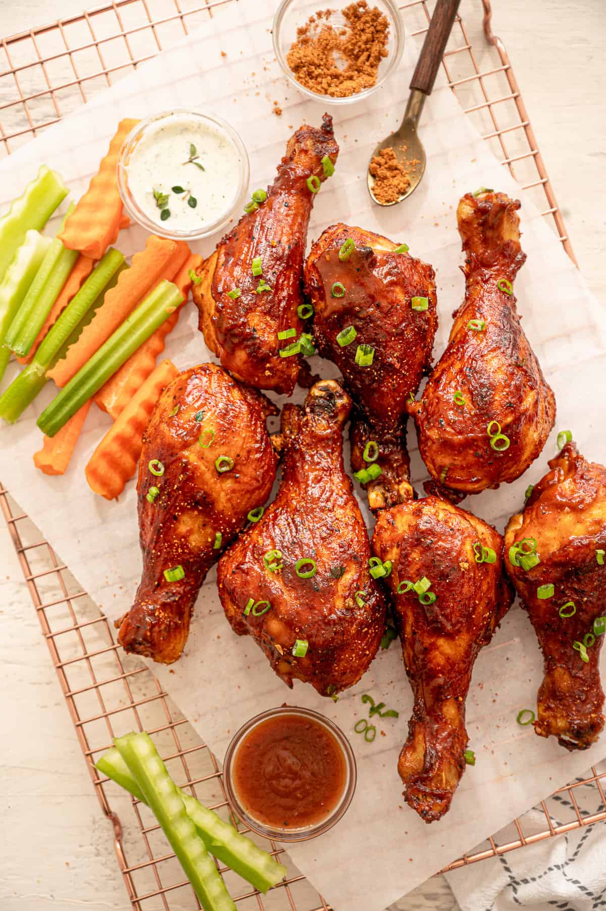 BBQ chicken drumsticks served with crinkle cut celery and carrots.
