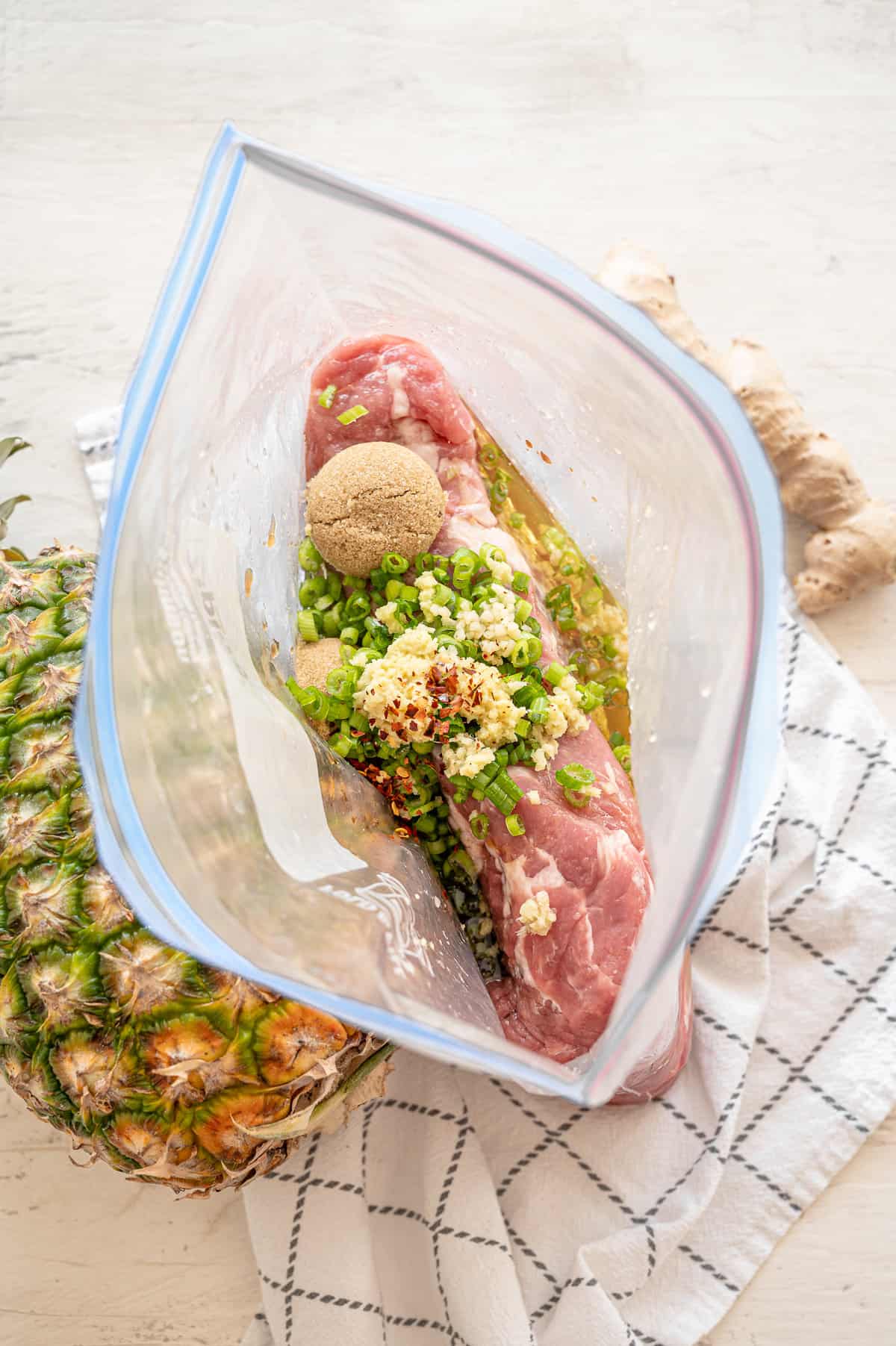 Ingredients for Hawaiian pork tenderloin in a freezer-safe bag.