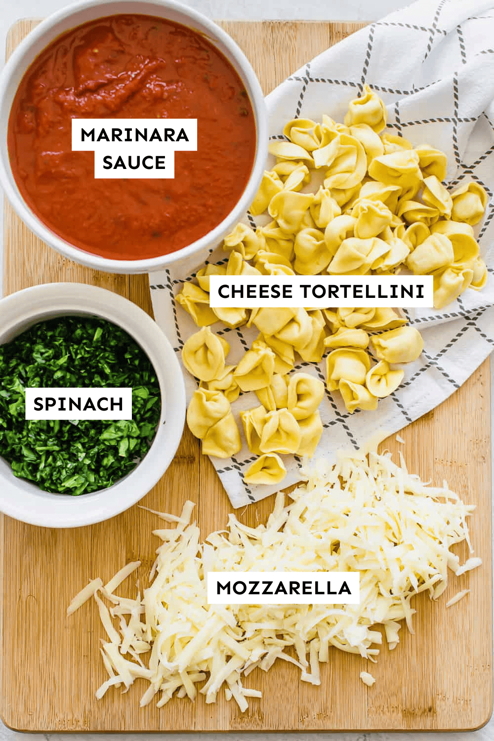 Baked tortellini ingredients measured out and labeled.