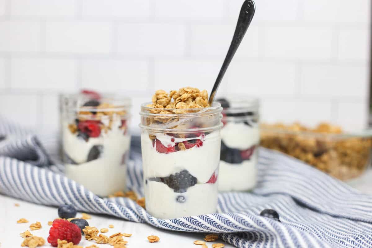 Make ahead yogurt parfaits in small mason jars topped with granola.
