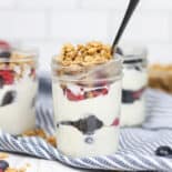 Make ahead yogurt parfaits in small mason jars topped with granola.