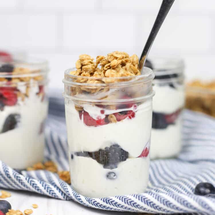 Make ahead yogurt parfaits in small mason jars topped with granola.