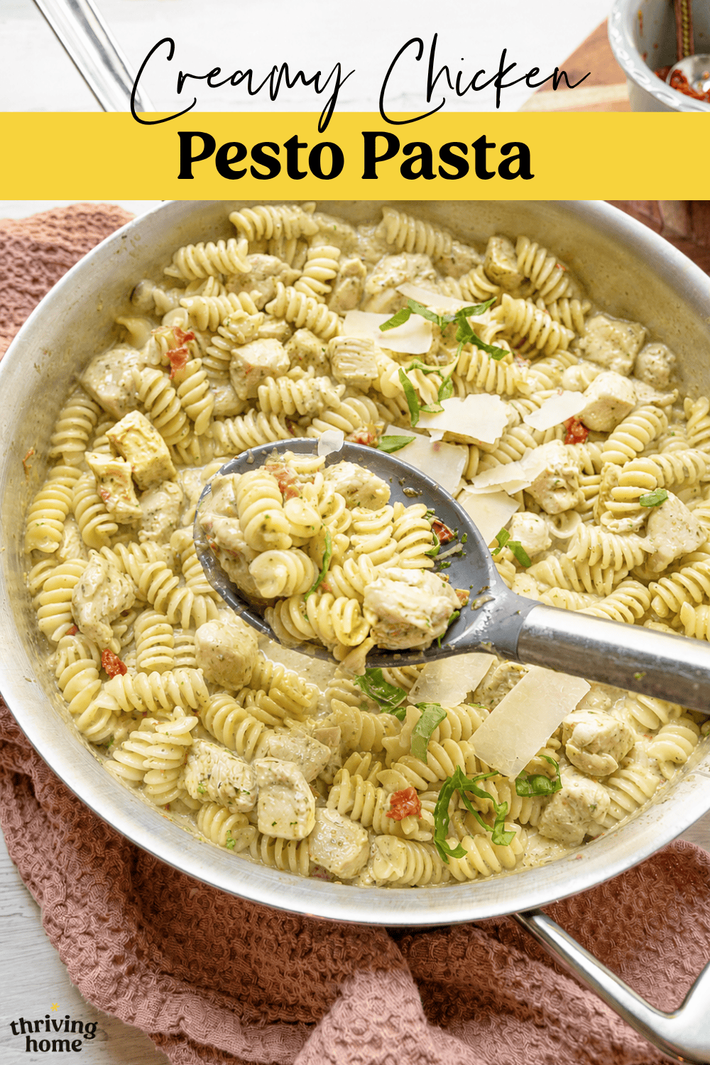 Creamy chicken pesto pasta in a skillet.