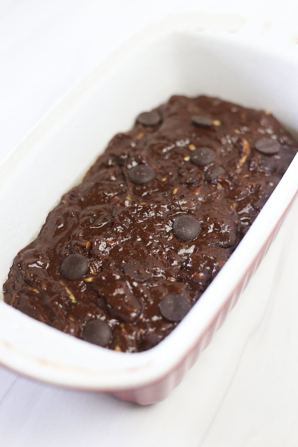 Double chocolate zucchini bread batter in a loaf pan.