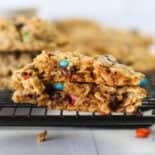 Two monster cookie halves stacked on top of each other.
