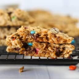 Two monster cookie halves stacked on top of each other.