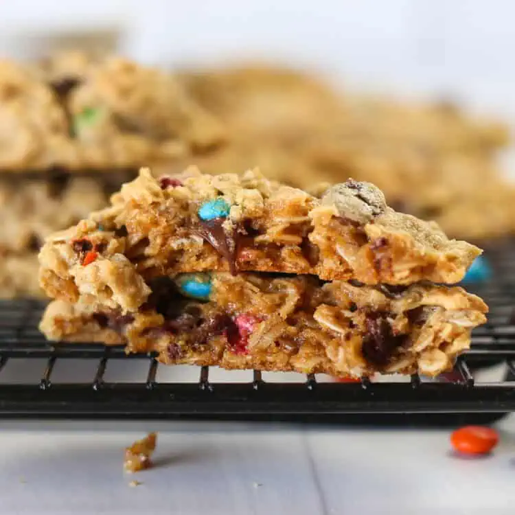Two monster cookie halves stacked on top of each other.