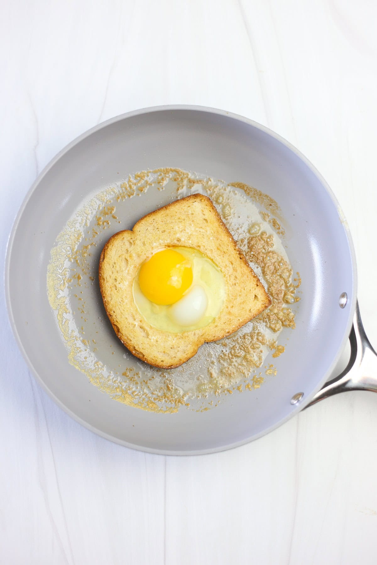 An egg added to make an egg in a hole on the skillet. 