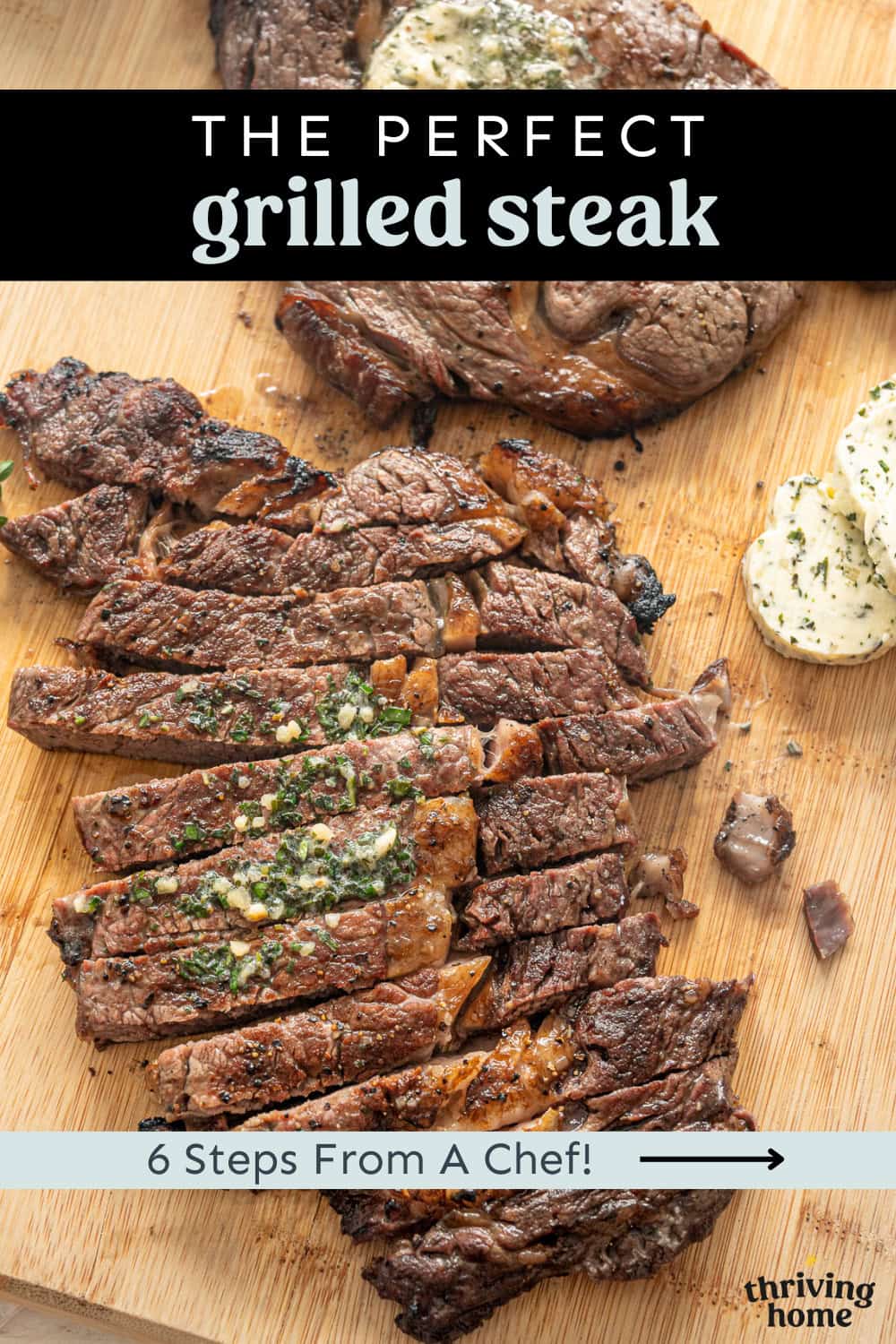 The perfect grilled steak sliced on a cutting board with garlic herb butter slices next to it.