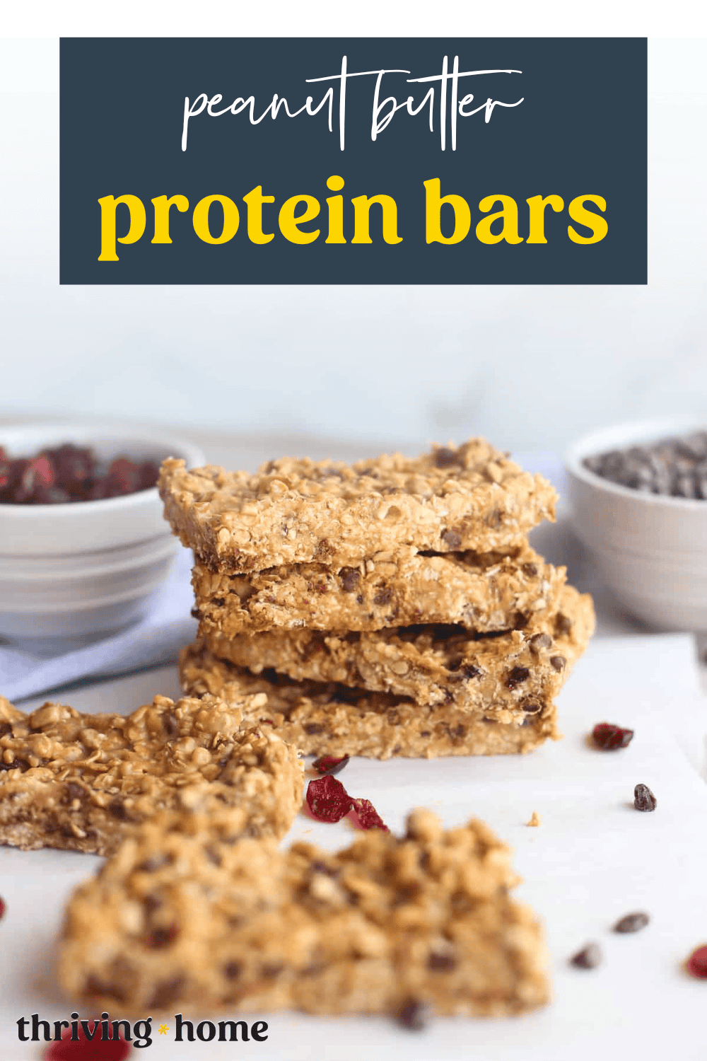Peanut butter protein bars stacked on a counter.