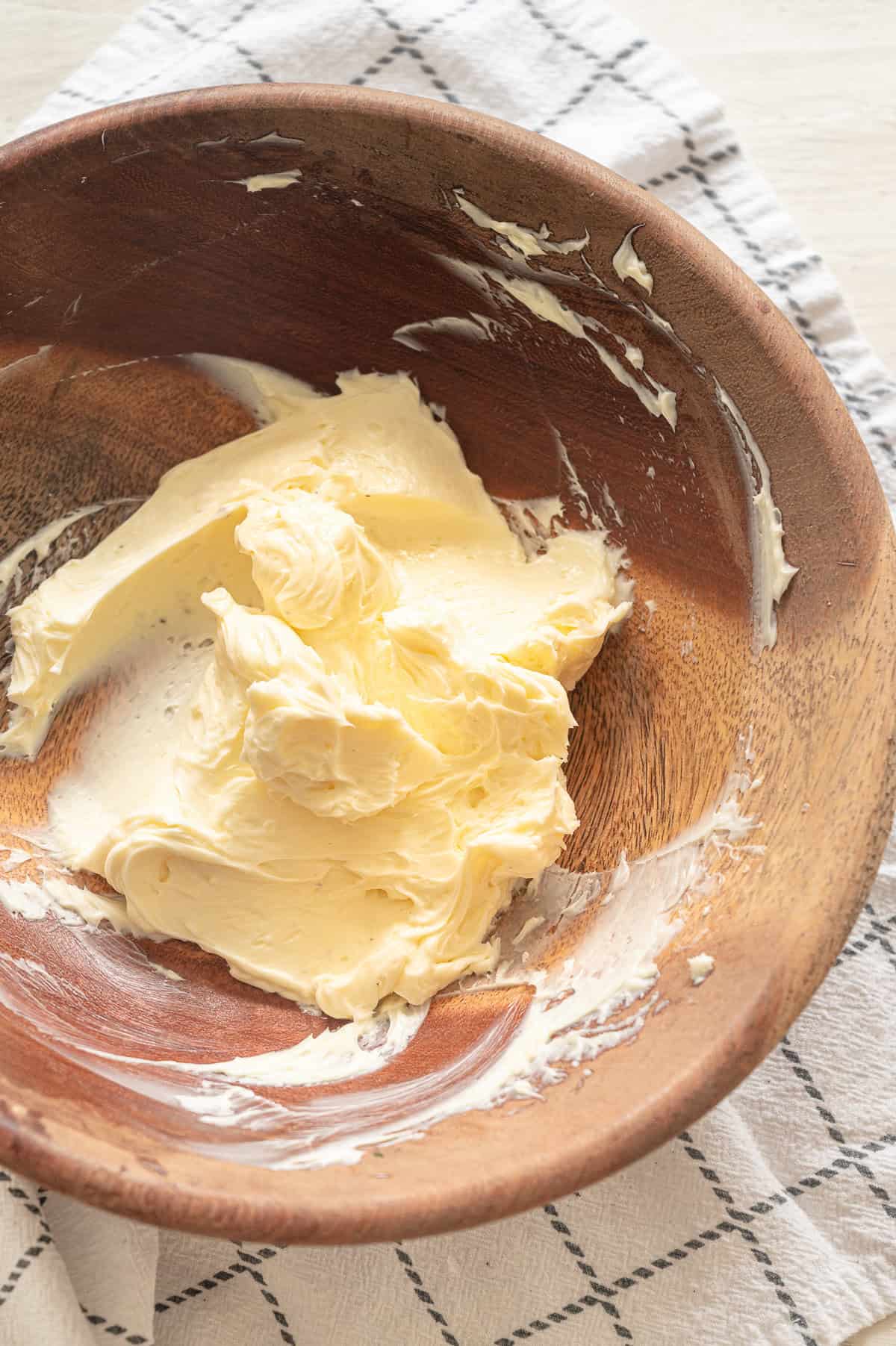 Whipped butter in a wooden bowl.