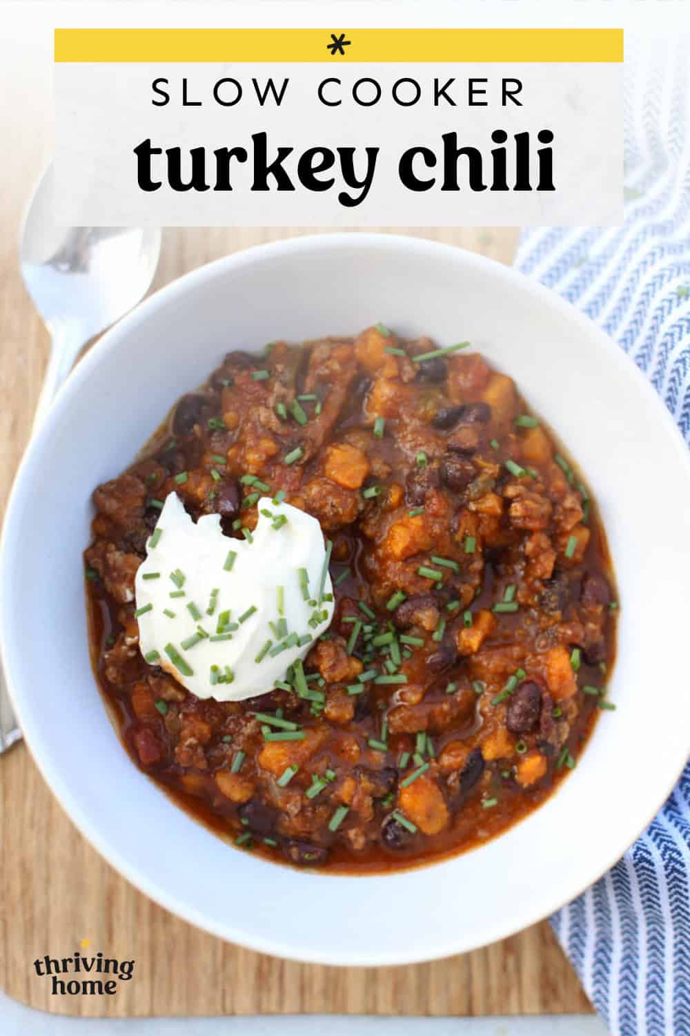 Bowl of slow cooker turkey chili with sweet potatoes and black beans in a white bowl.