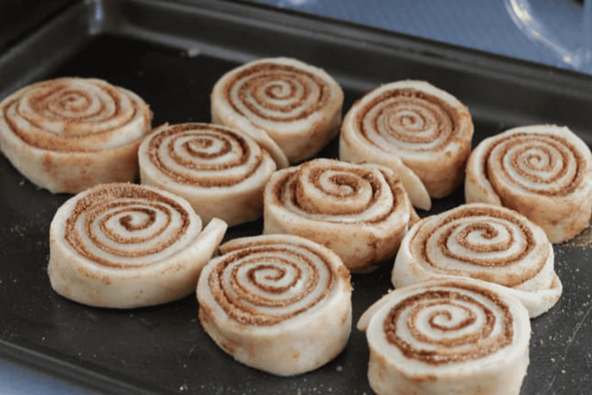 Cinnamon rolls on a pan ready to bake.