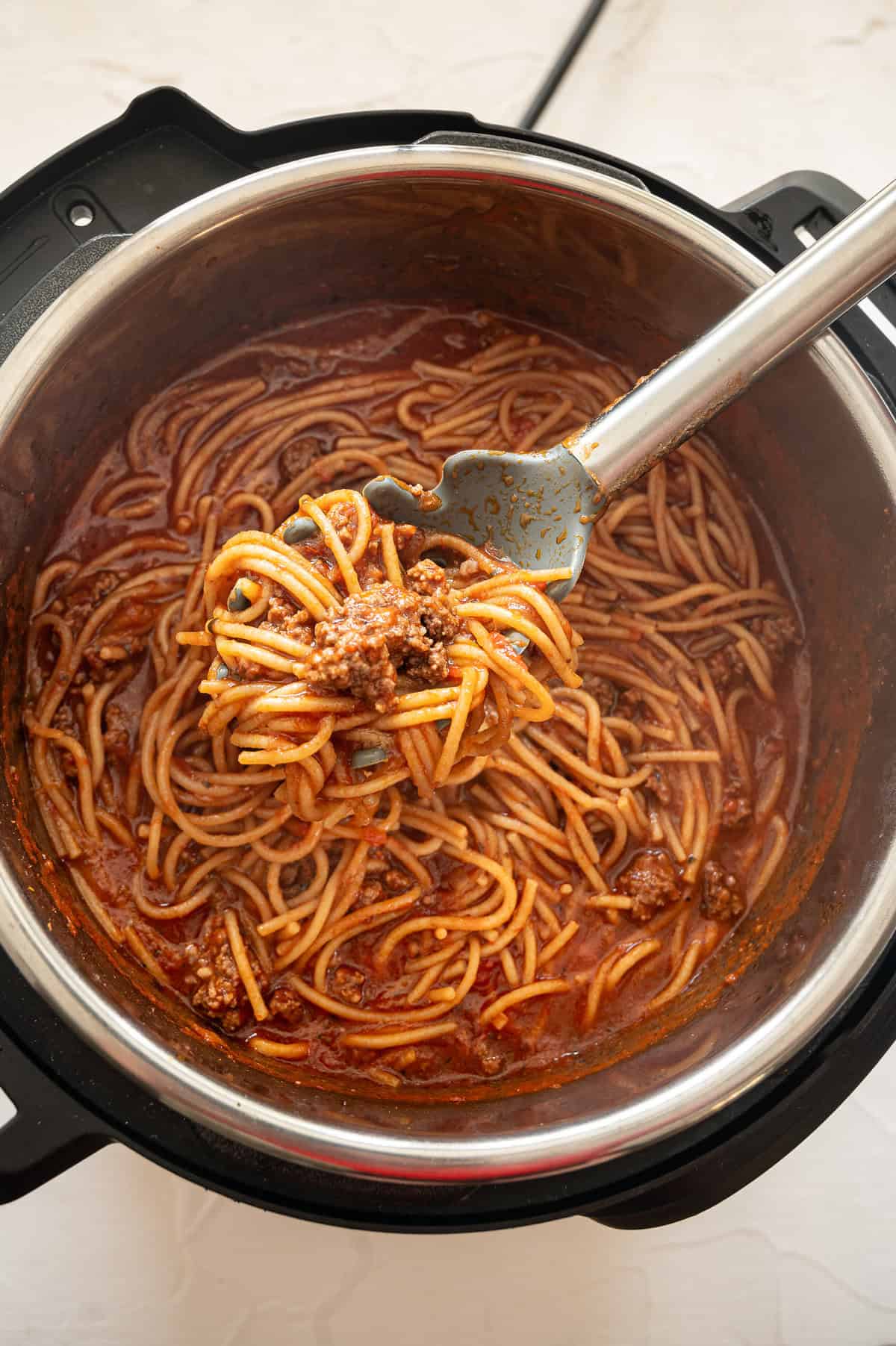 Spaghetti with meat being served from the Instant Pot.