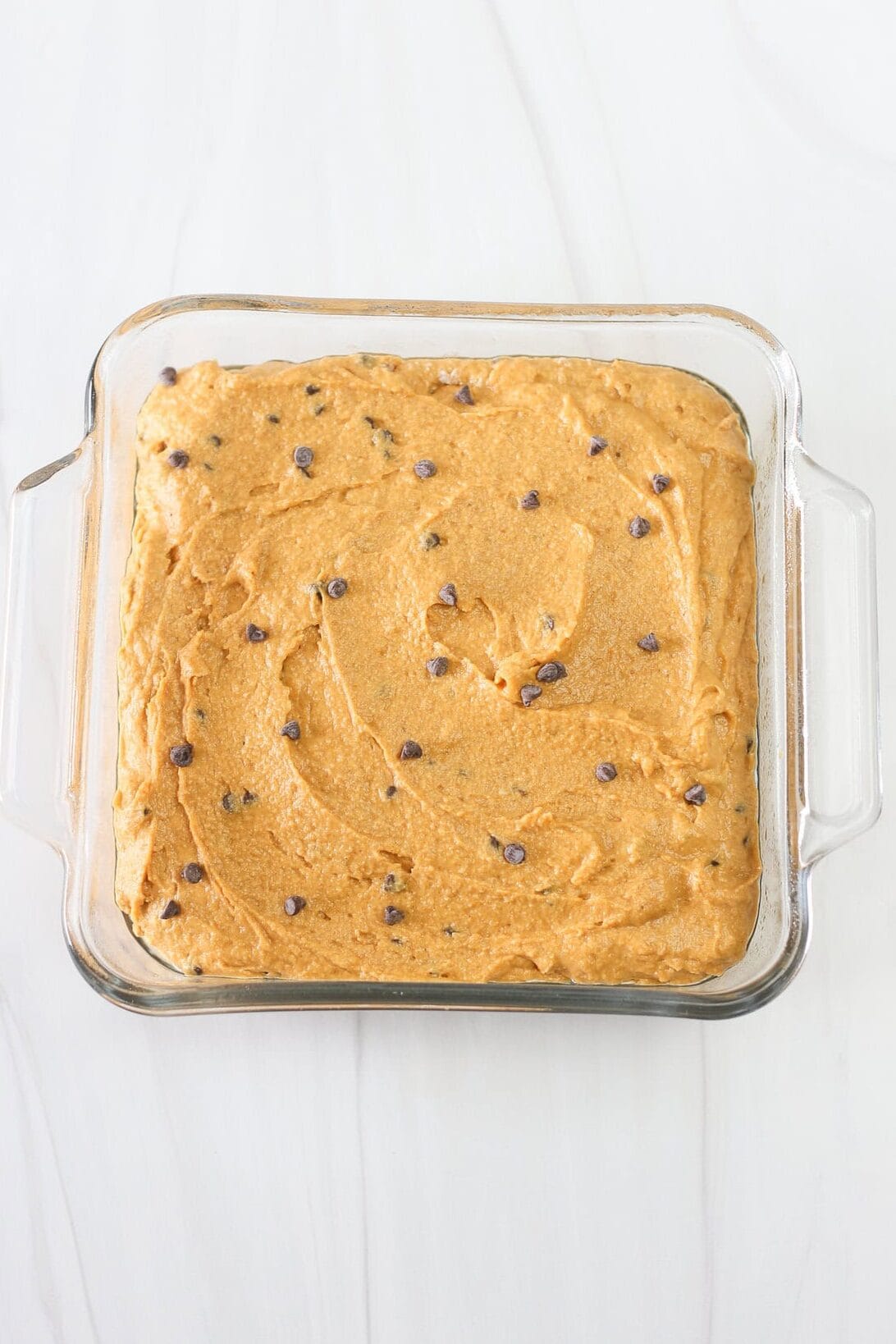 Banana breakfast cake batter in a square baking dish.