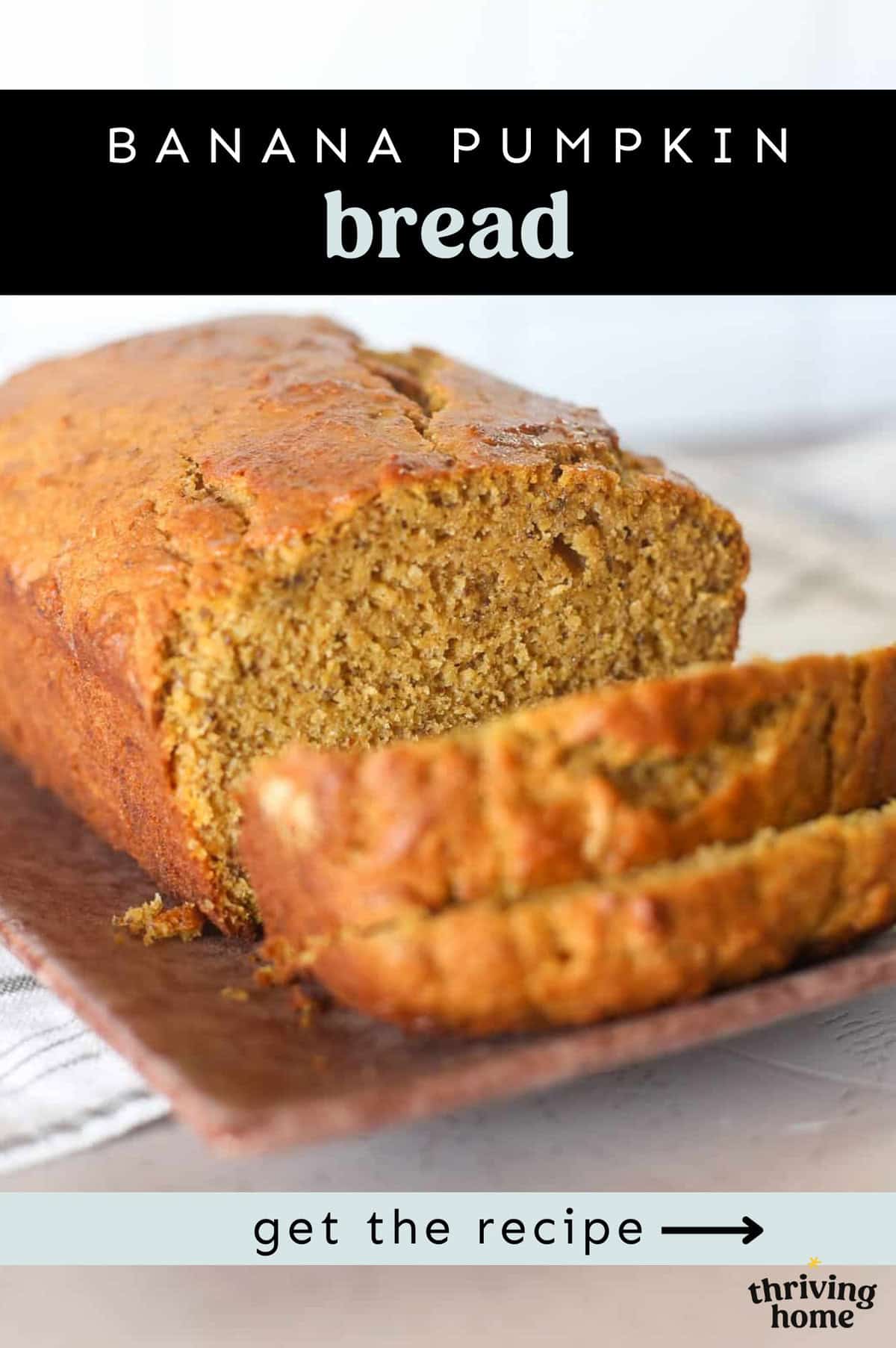 A loaf of banana pumpkin bread on a wooden cutting board with a few slices cut.