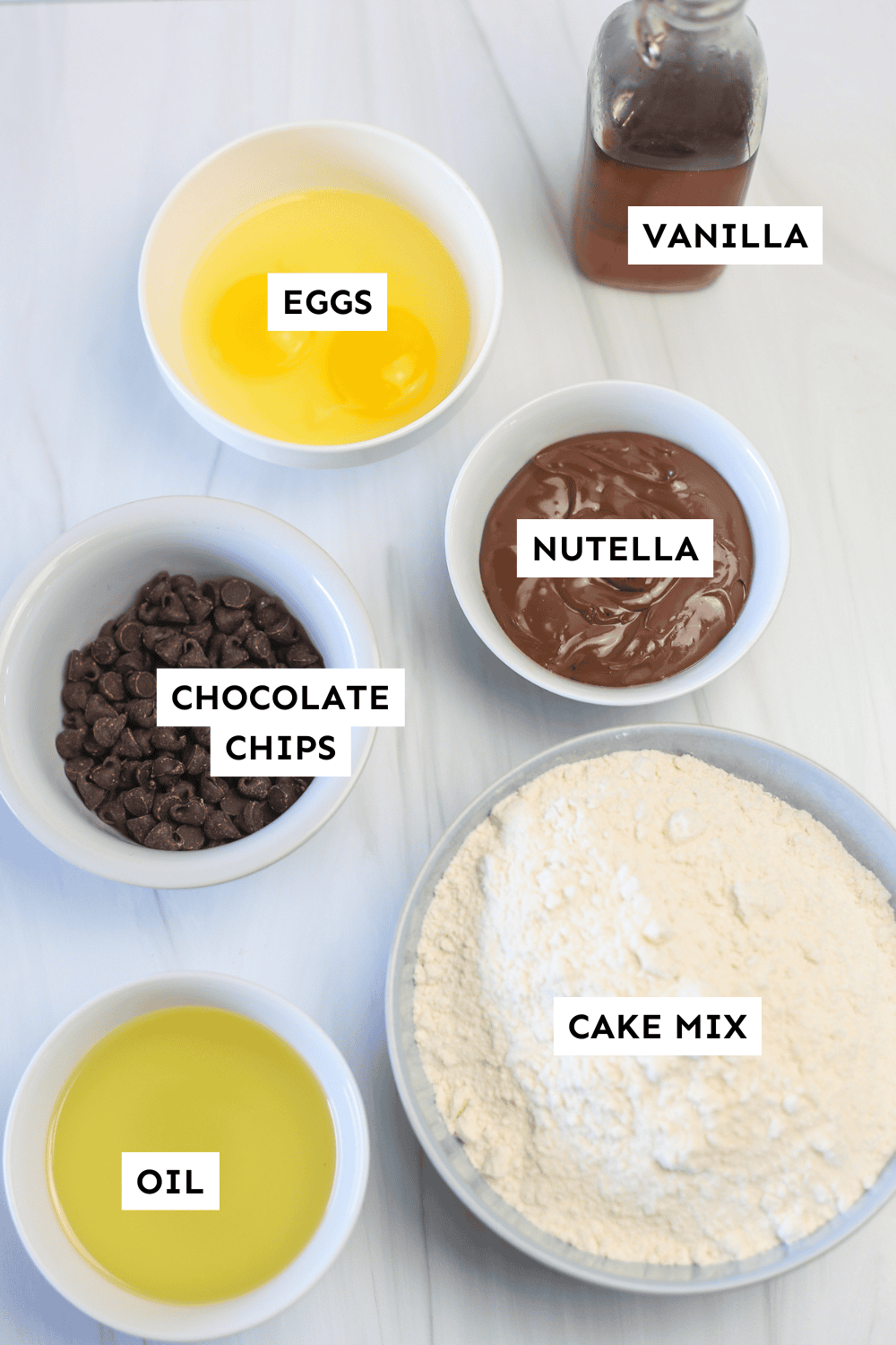 Nutella cake mix cookie ingredients measured out and labeled.