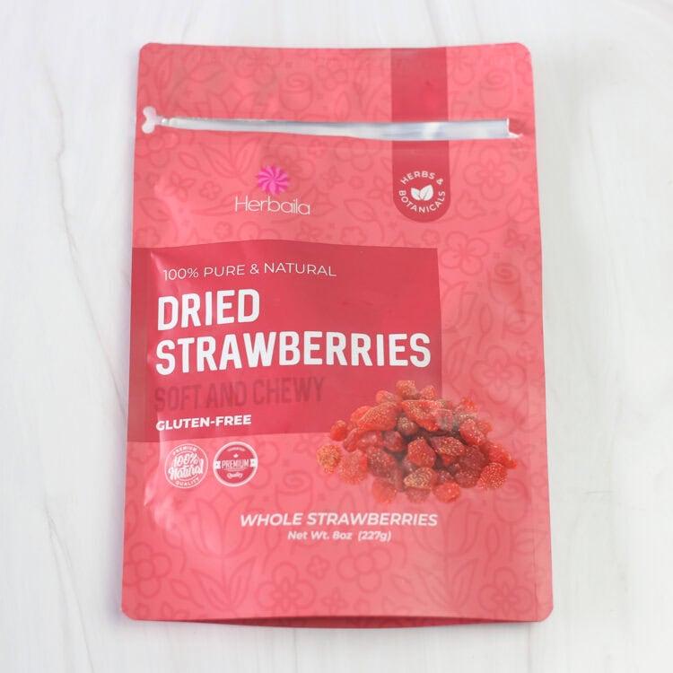 Package of dried strawberries on a counter.