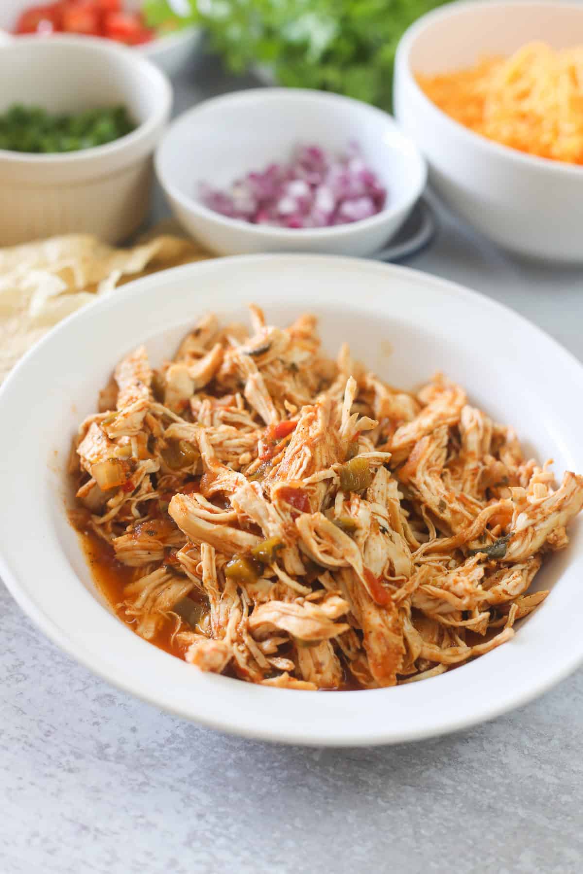 Shredded chicken in a bowl. 