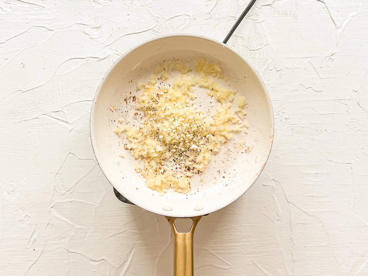 Sauted onions in a skillet with minced garlic, salt and pepper.