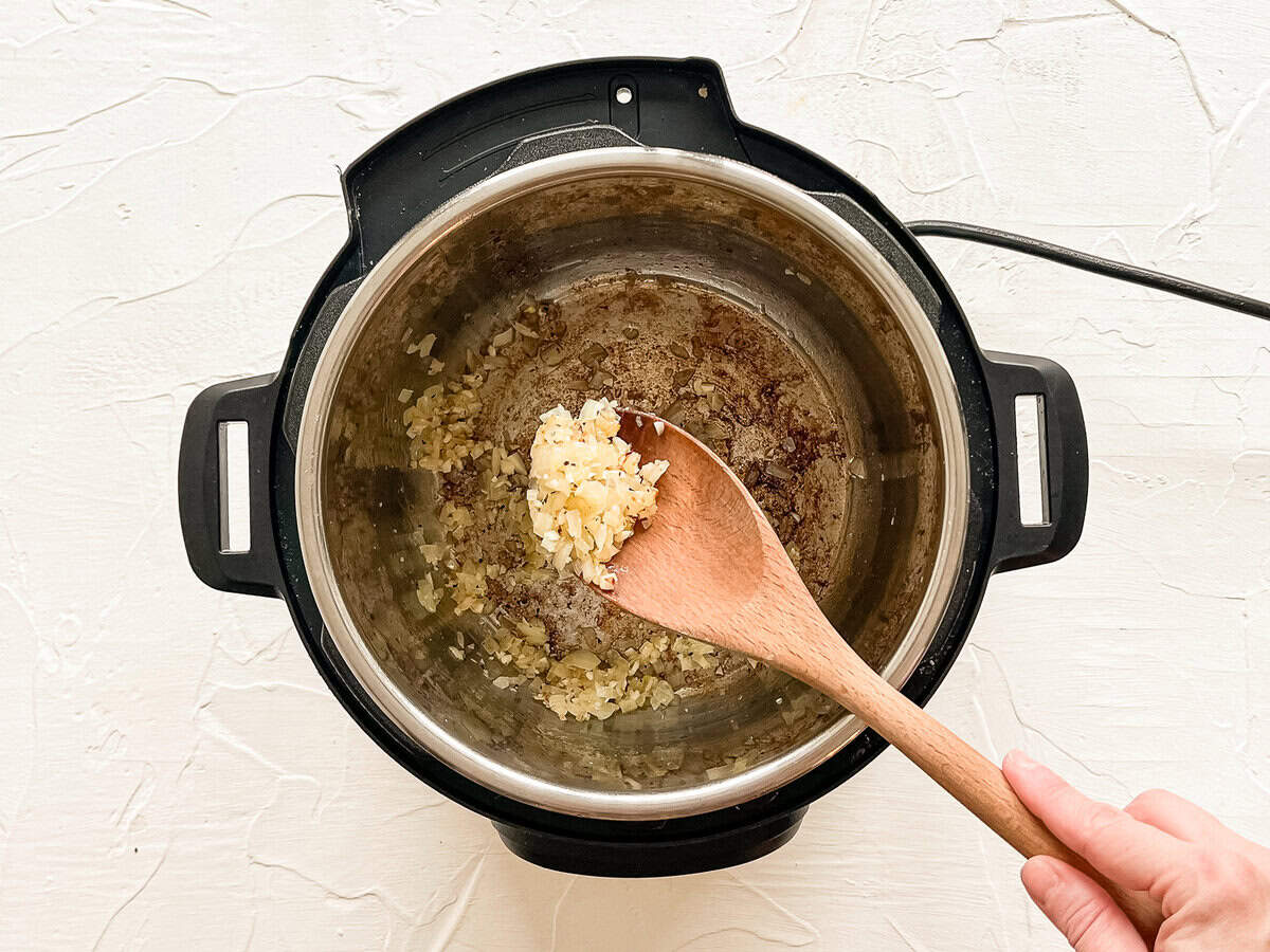 Onions sauteeing in an Instant Pot.