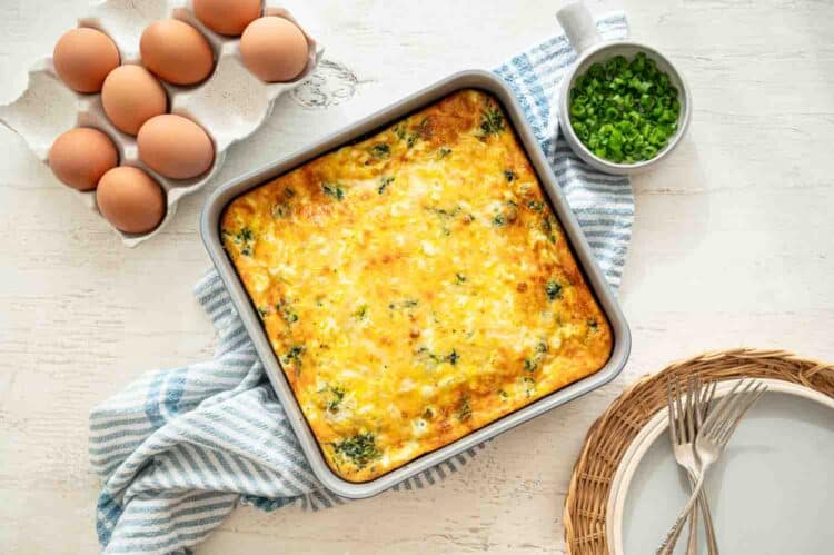 A 9x9 baking dish of Mediterranean crustless quiche ready to serve.