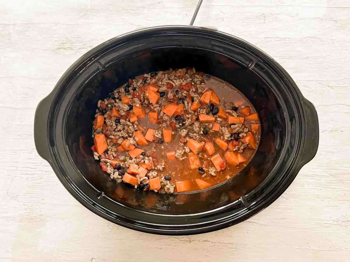 Turkey chili ingredients in a slow cooker ready to cook.