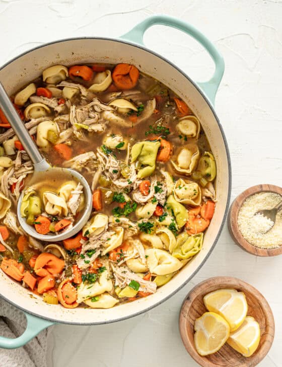 A large pot of chicken tortellini soup ready to serve.