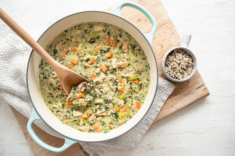 Boursin chicken and wild rice soup in a dutch oven ready to serve.