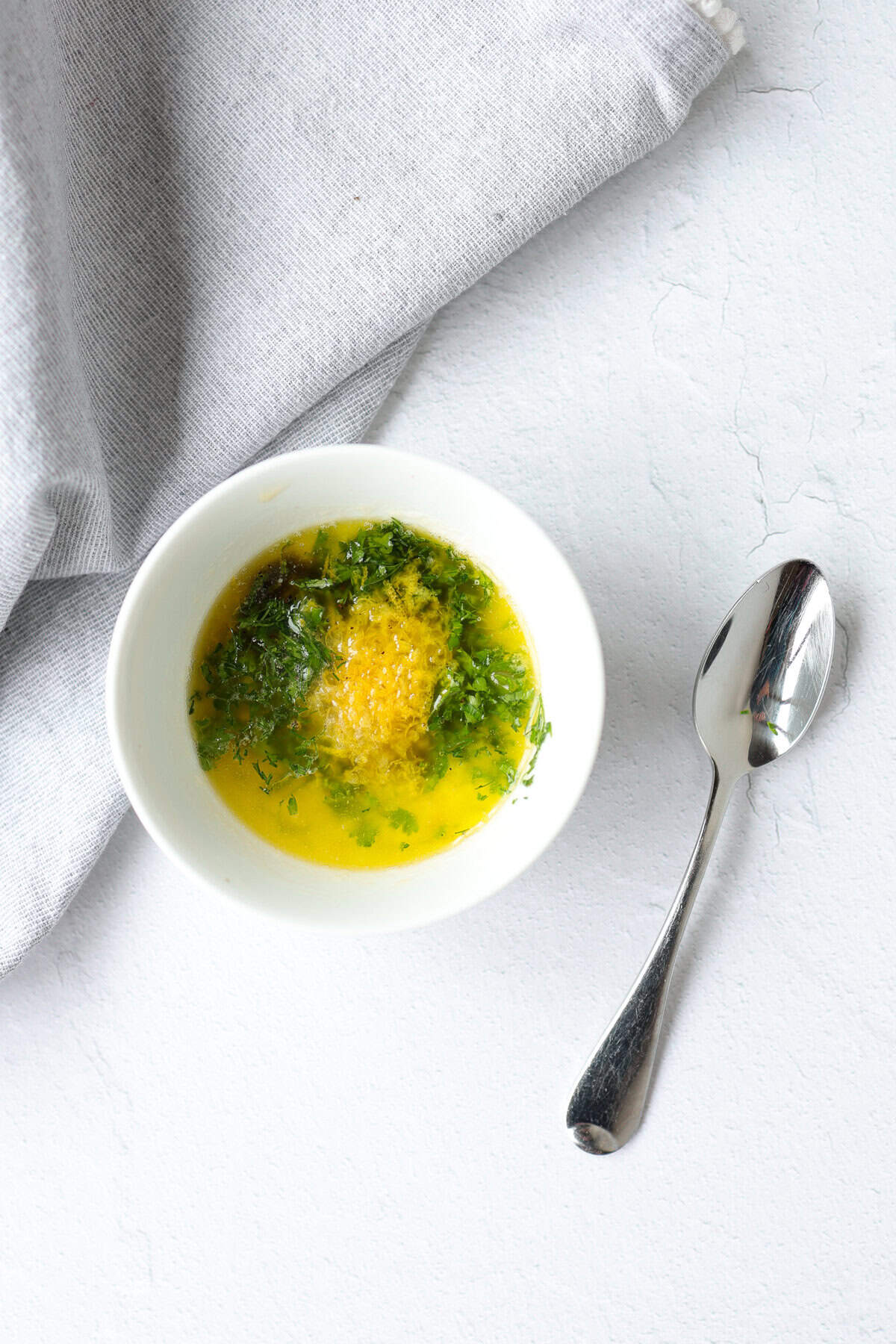 Lemon garlic marinade in a small white bowl.