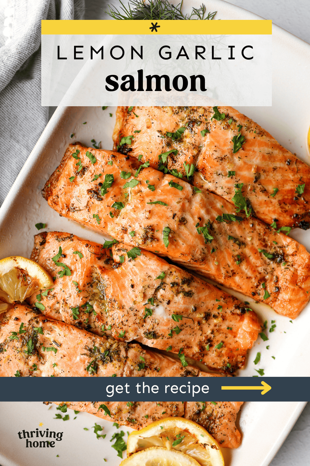 Lemon garlic salmon with grilled lemon slices and chopped parsley on top.