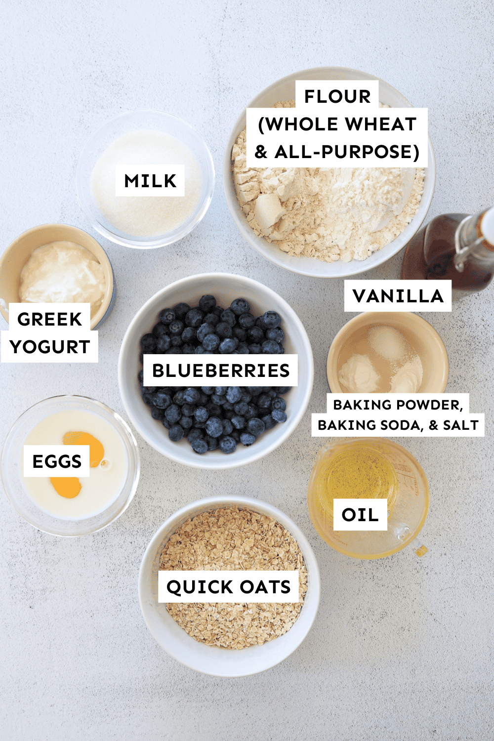 Ingredients for blueberry oatmeal muffins measured out and labeled.