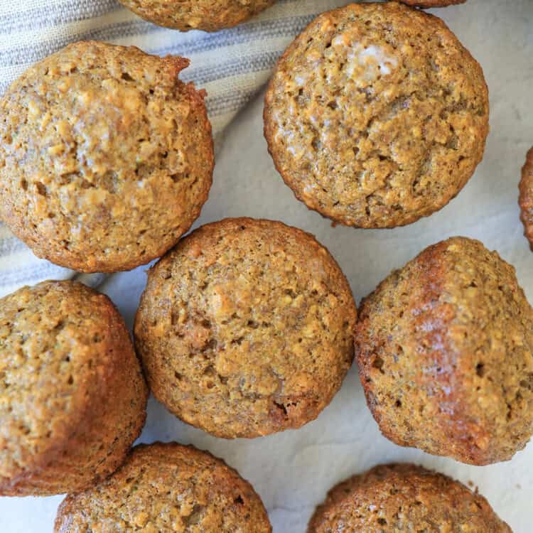 A bunch of muffins on a white table.