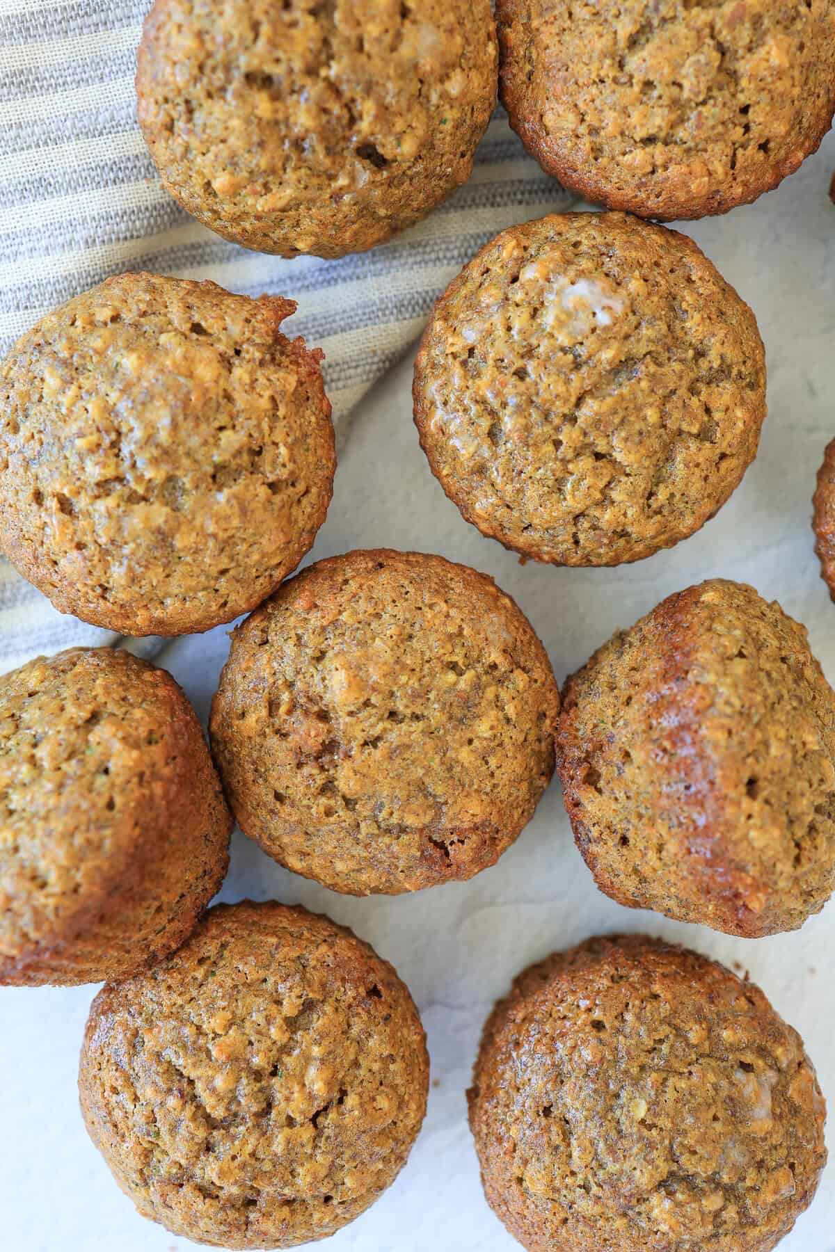 A bunch of muffins on a white table.