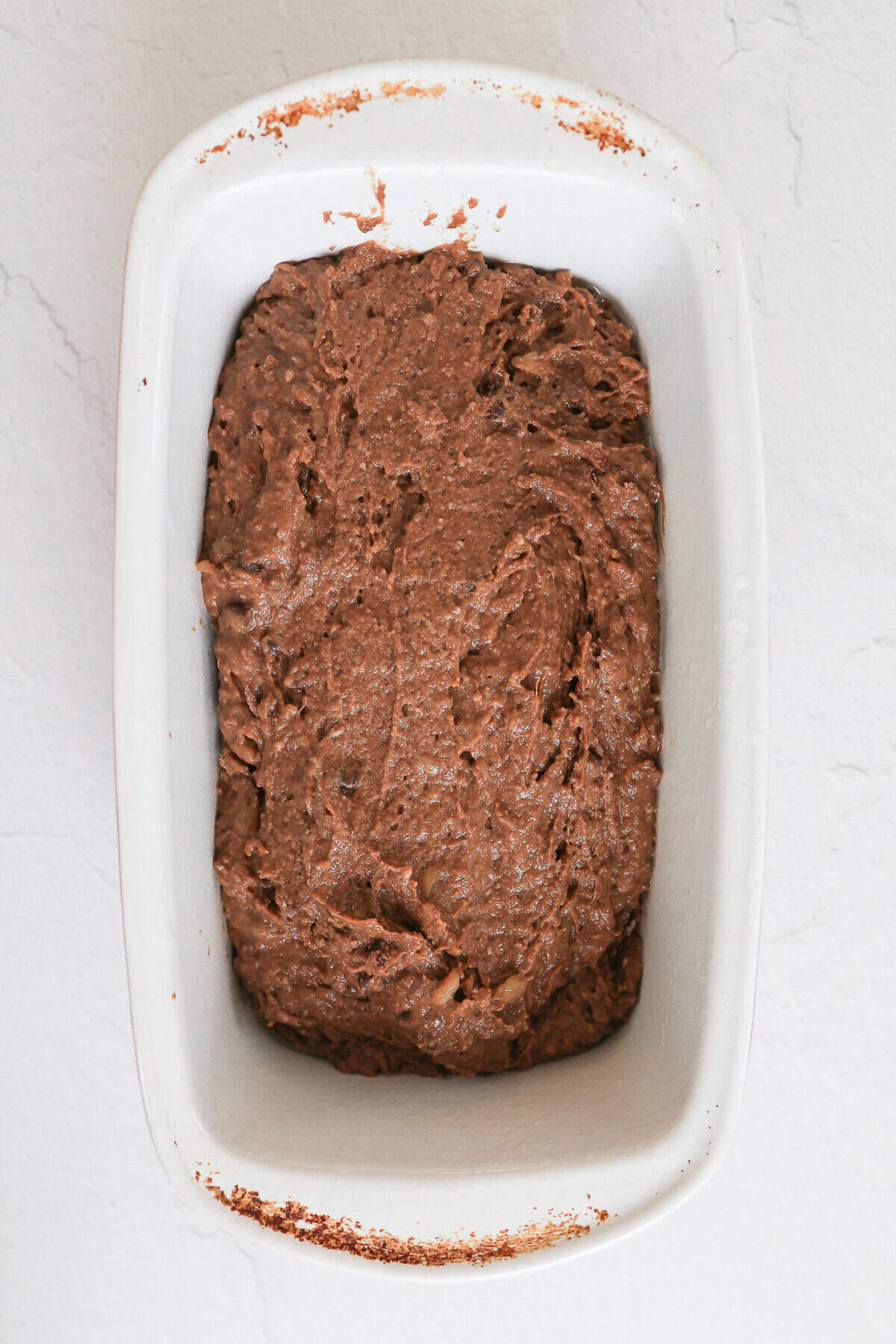 Chocolate sweet potato bread batter in a load pan.