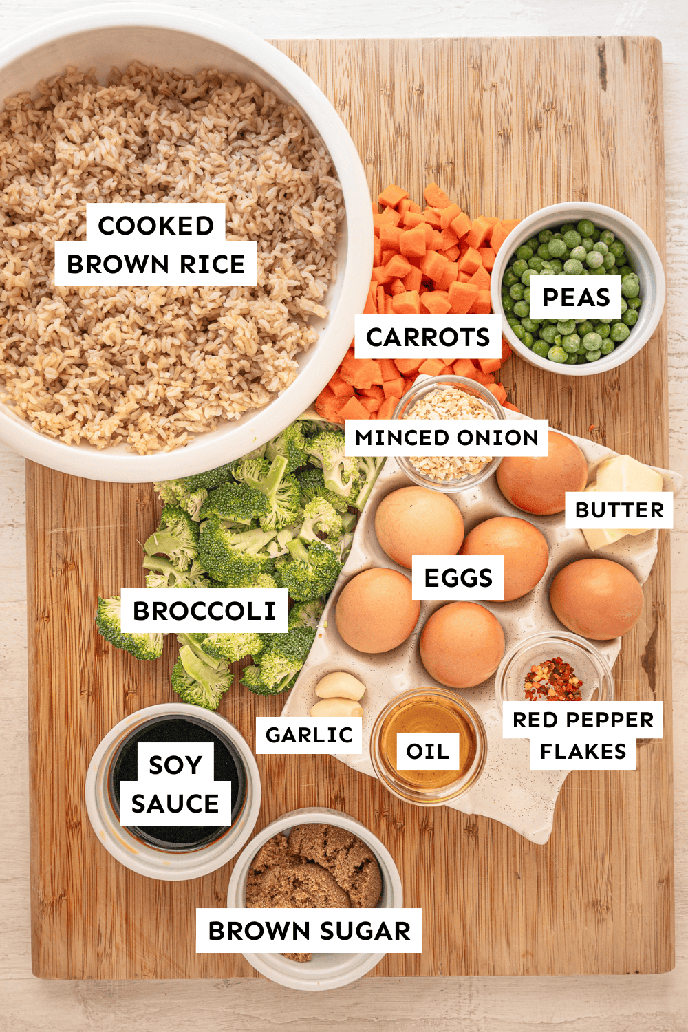 Ingredients for egg fried rice with sweet soy sauce measured out and labeled.