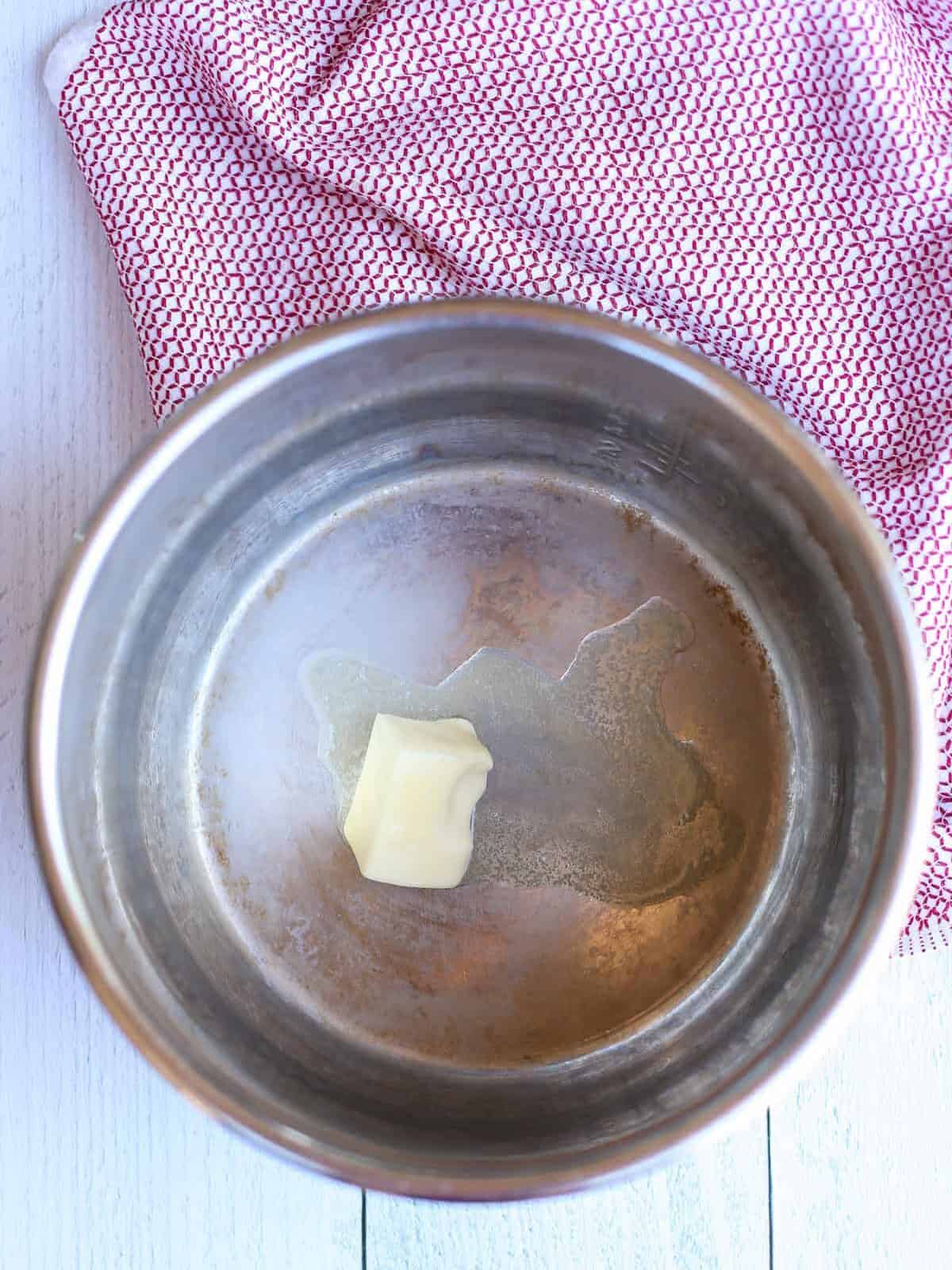 Butter being melted in an the instant pot.