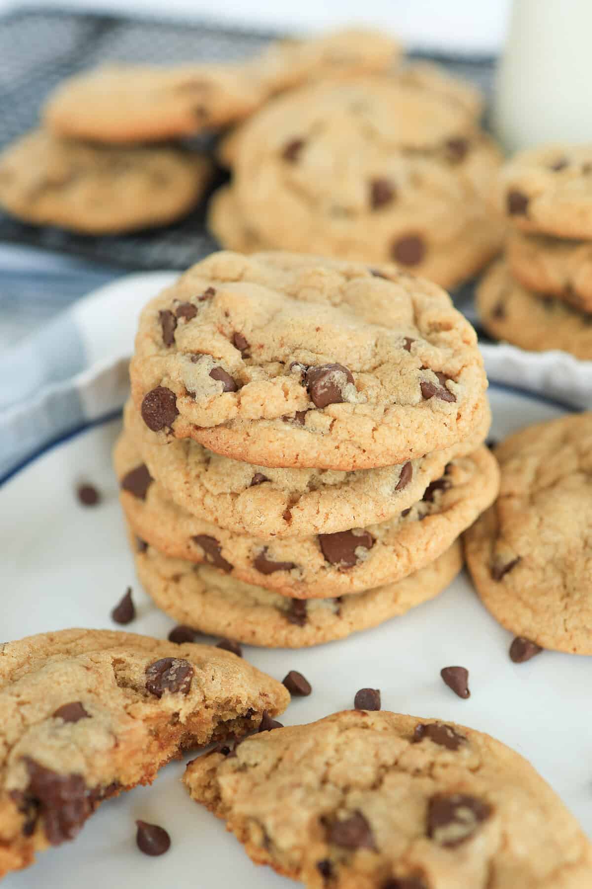 A stack of chocolate chip cookies on a plate.