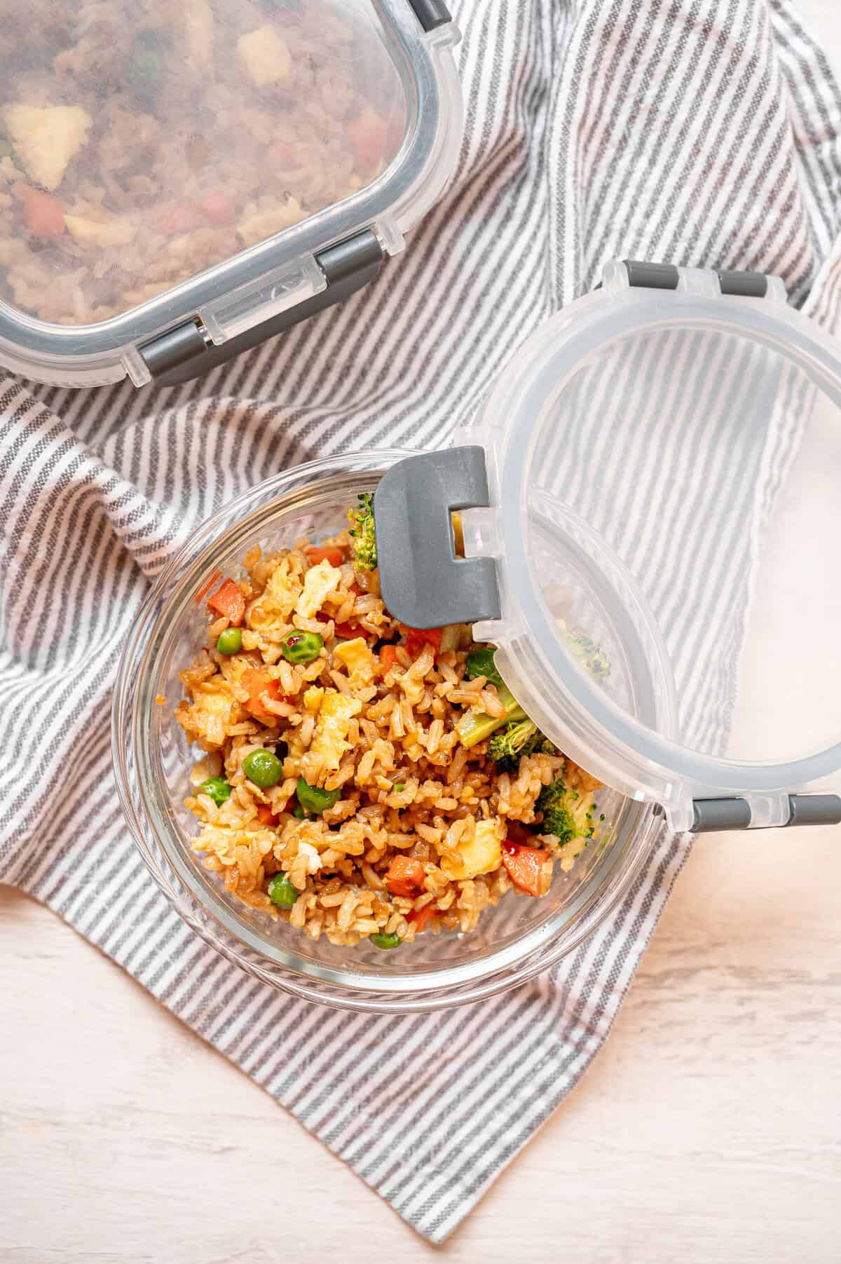 Egg fried rice in a 2-cup glass container for the freezer.