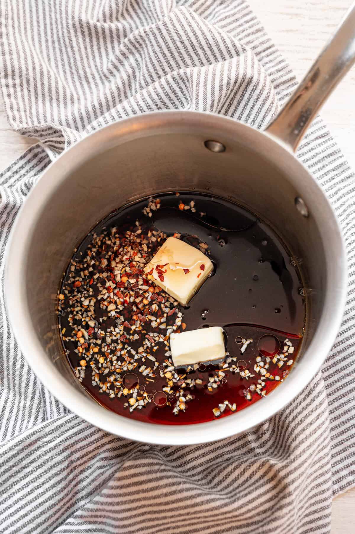 Ingredients for sweet soy sauce in a pan.